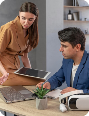 two individuals collaborating in a modern work
