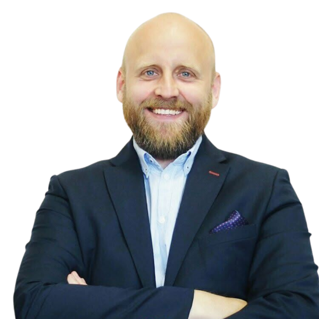 A smiling man in a suit with a beard
