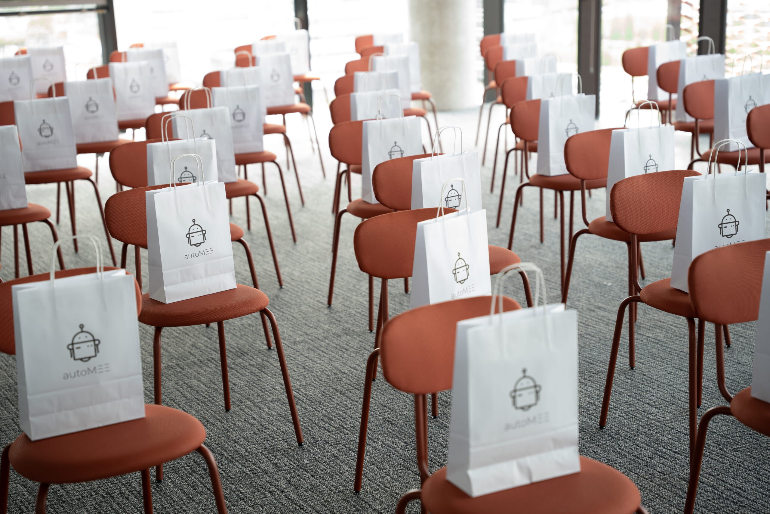Empty chairs with conference gift bags